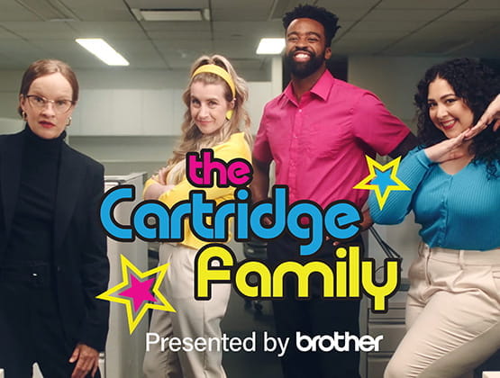 The Cartridge Family posing in an office.