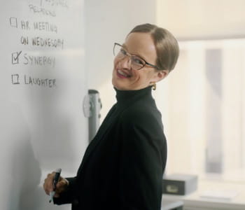Brenda in black drawing on whiteboard