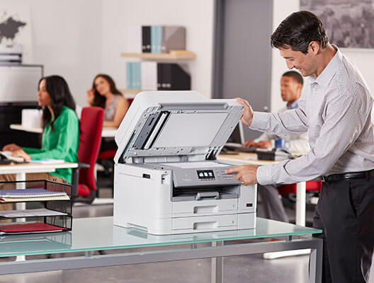 Man using Brother scanner in office