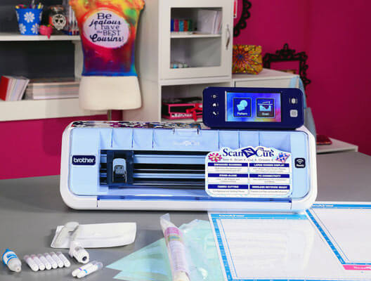 Brother ScanNCut machine surrounded by supplies