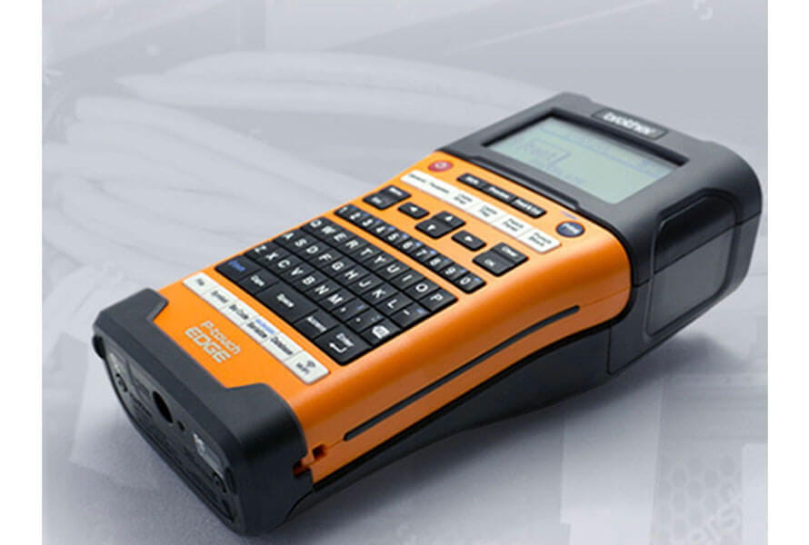 Side view of an orange Brother P-touch