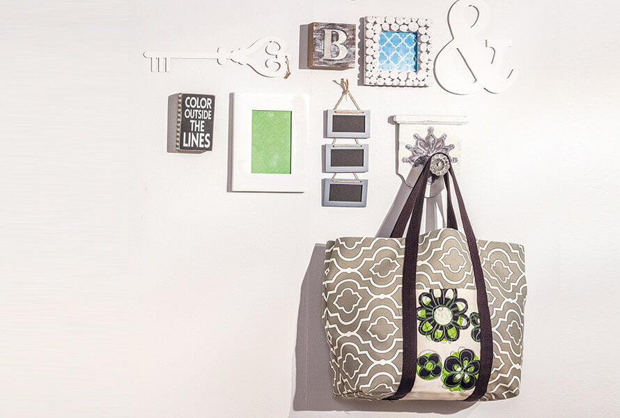 Custom bag hanging on wall with wall art