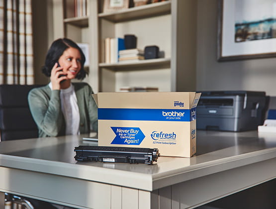 Open Refresh box with toner cartridge and woman on phone smiling