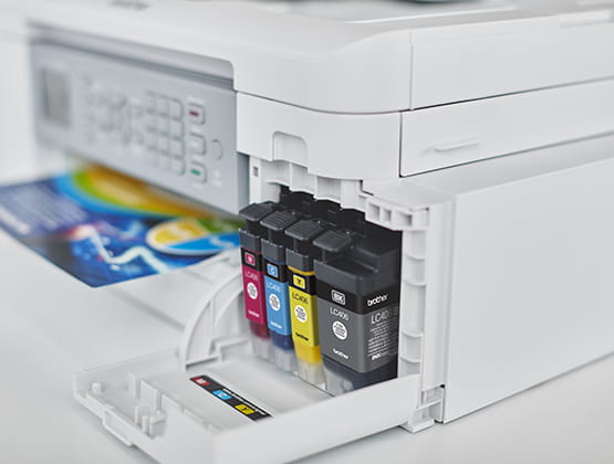 Ink printer with ink bay open and cartridges visible