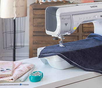 Stitch tapering shown with blue fabric being sewn