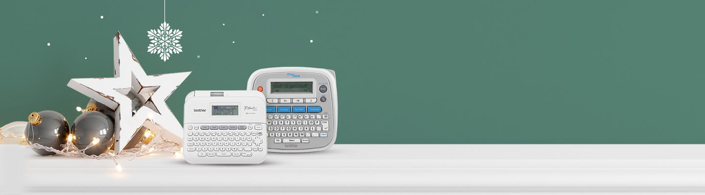 P-touch label makers on green background with star and holiday decorative balls
