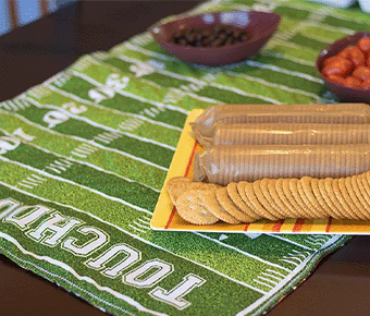 Football field themed table runner with game day snacks