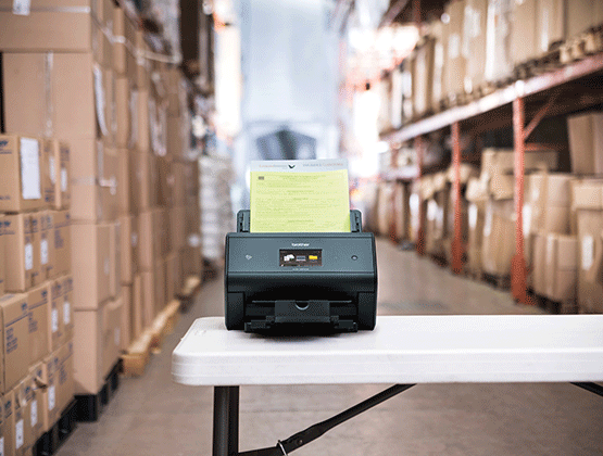 ADS model on table in warehouse with boxes on shelves