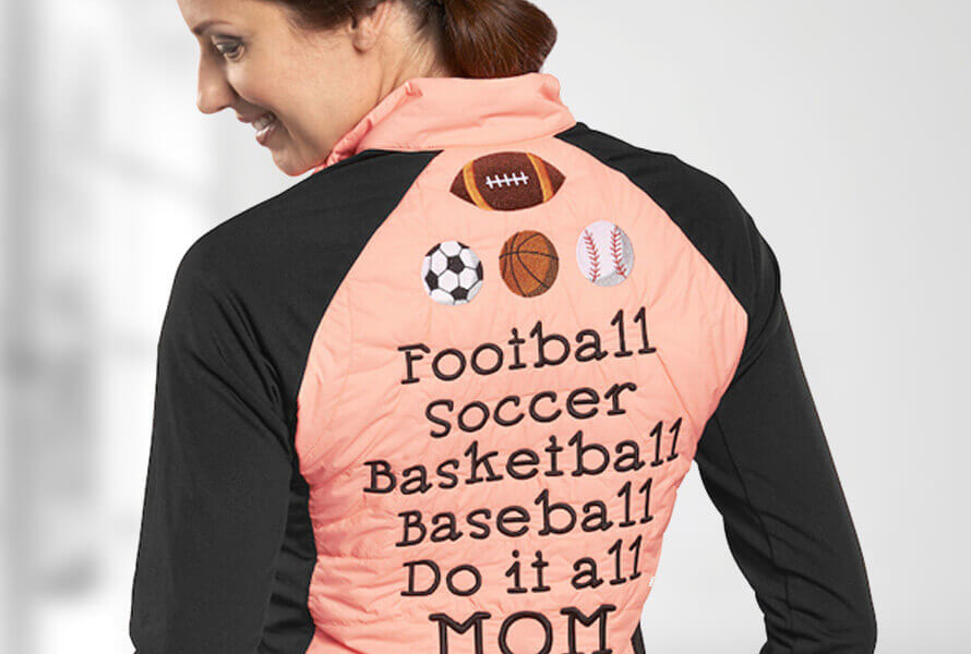 Woman wearing long-sleeve tee that reads "Football Soccer Basketball Baseball Do it all MOM"