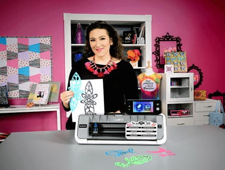 Woman displays her work created with Brother CM350