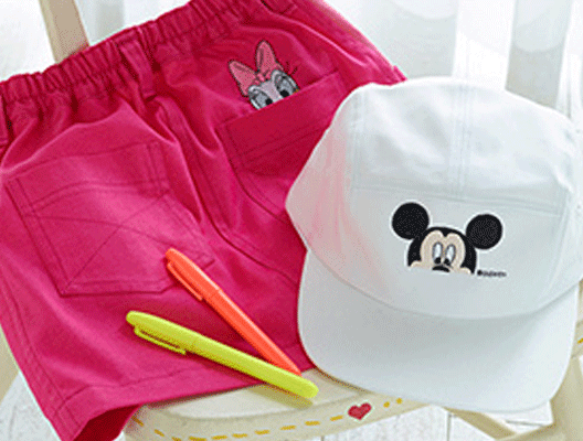 Pink shorts and white hat with Disney embroidery