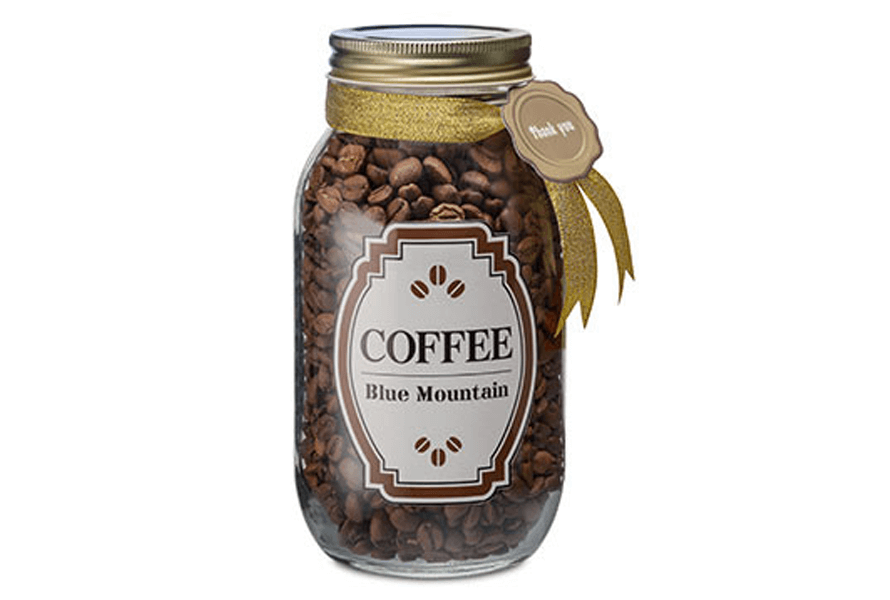 Custom "Coffee" label on a clear glass jar containing coffee beans