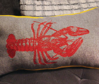 Pillow with lobster embroidery design