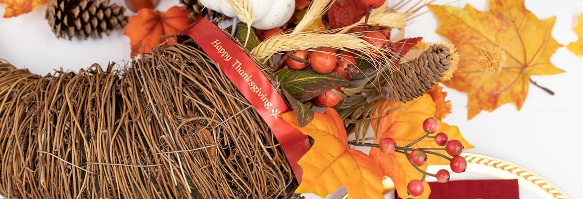 Cornucopia centerpiece with Happy Thanksgiving ribbon made with Ptouch Embellish