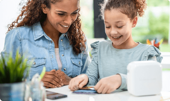 Mother and daughter decorating with label tapes
