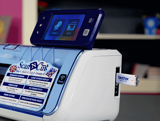Side view of a Brother ScanNCut machine with USB drive inserted