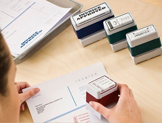 Woman using custom stamps