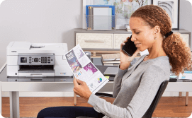 Model on phone with print-out